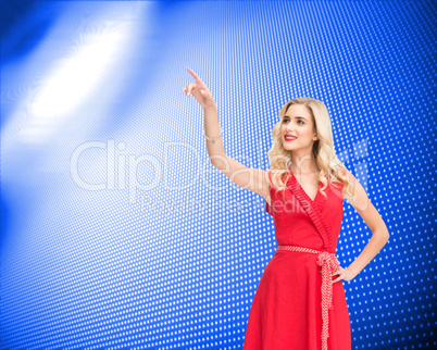 Composite image of smiling blonde pointing