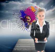 Composite image of businesswoman holding new tablet