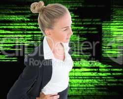 Composite image of businesswoman standing with hands on hips
