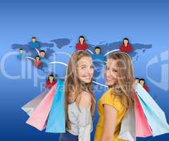Composite image of two young women with shopping bags