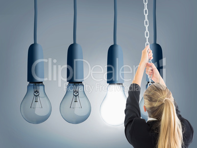 Composite image of businesswoman pulling a chain