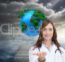 Composite image of smiling doctor presenting her hand