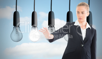 Composite image of businesswoman pointing somewhere