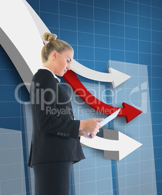 Composite image of businesswoman holding tablet