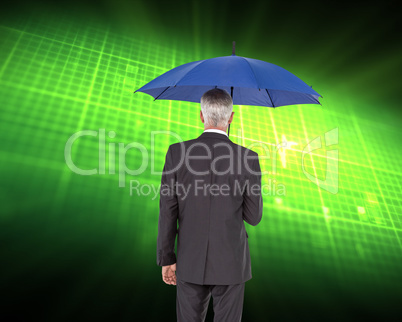 Composite image of businessman holding umbrella