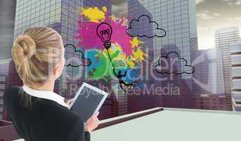 Composite image of businesswoman holding new tablet