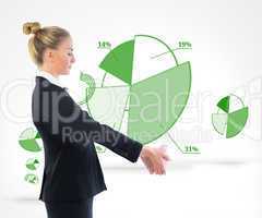 Composite image of businesswoman holding piggy bank