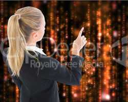 Composite image of businesswoman pointing somewhere