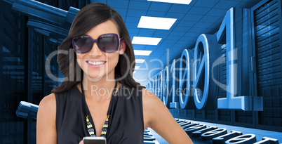 Composite image of happy brunette holding smartphone