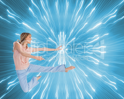 Composite image of woman doing dance pose