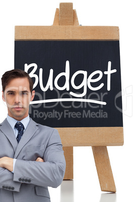 Composite image of young businessman looking at camera