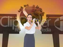 Composite image of astonished elegant businesswoman holding bino