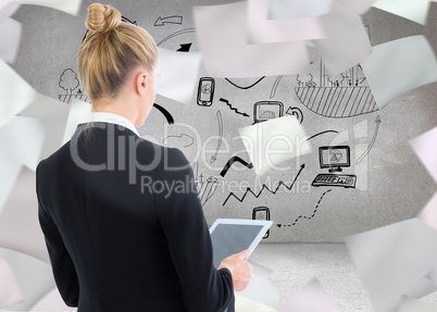 Composite image of businesswoman holding tablet