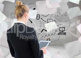 Composite image of businesswoman holding tablet