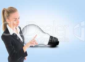 Composite image of businesswoman pointing somewhere