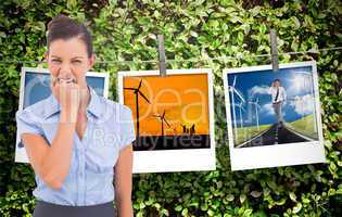 Composite image of furious businesswoman looking at the camera