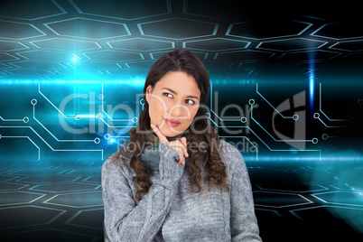 Composite image of pensive model wearing winter clothes holding