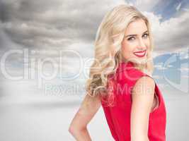 Composite image of smiling blonde standing hands on hips