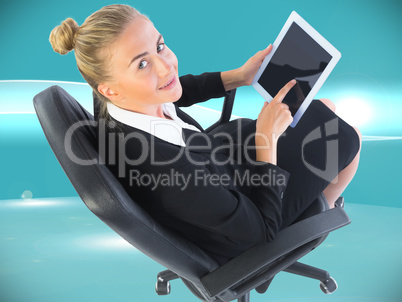 Composite image of businesswoman sitting on swivel chair with ta