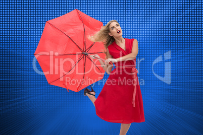 Composite image of elegant blonde holding umbrella