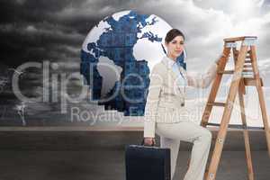 Composite image of businesswoman climbing career ladder with bri
