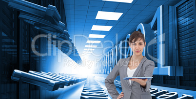 Composite image of attractive businesswoman holding tablet pc