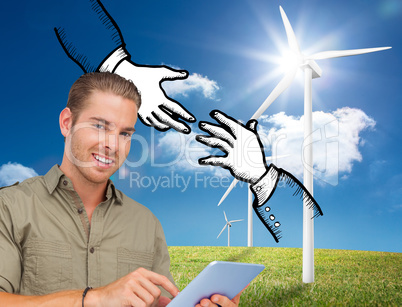 Composite image of happy man using tablet pc