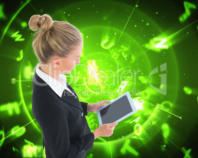 Composite image of businesswoman holding new tablet