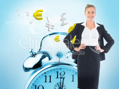 Composite image of businesswoman standing with hands on hips