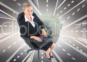 Composite image of businesswoman sitting on swivel chair with la