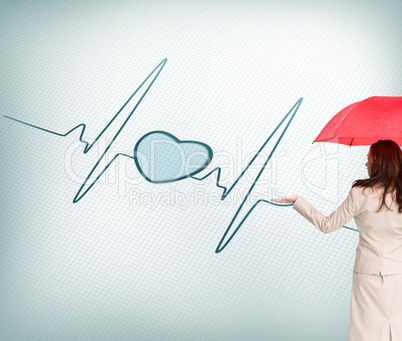 Composite image of businesswoman holding umbrella