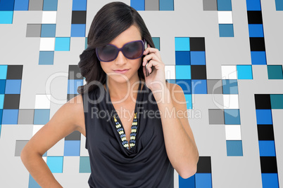 Composite image of serious elegant brunette wearing sunglasses o