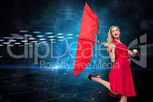 Composite image of elegant blonde holding umbrella