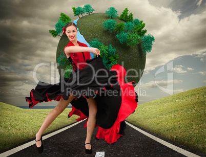 Composite image of dancing woman in a red and black dress