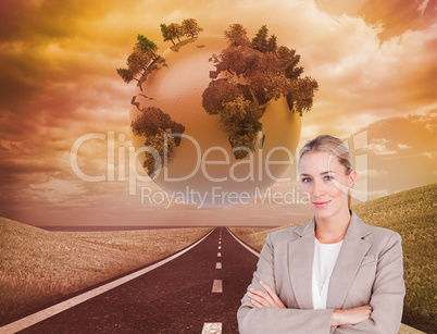 Composite image of confident female executive with folded arms