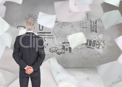 Composite image of rear view of serious businessman posing