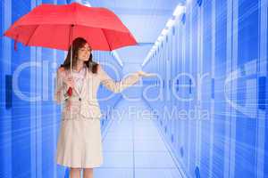 Composite image of attractive businesswoman holding red umbrella