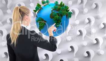 Composite image of businesswoman pointing somewhere