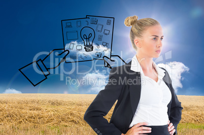 Composite image of businesswoman standing with hands on hips