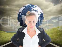 Composite image of businesswoman standing with hands on hips