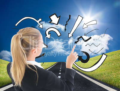 Composite image of businesswoman pointing somewhere