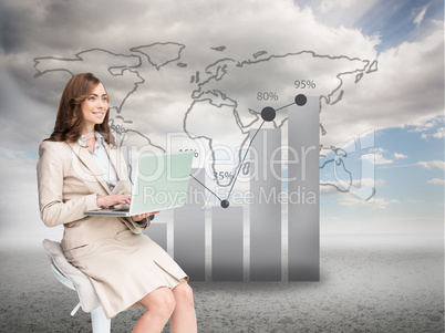 Composite image of smiling businesswoman sitting and using lapto