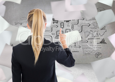 Composite image of business woman pointing somewhere