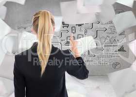 Composite image of business woman pointing somewhere