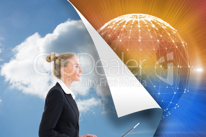 Composite image of businesswoman using laptop