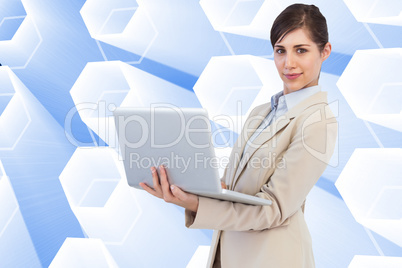 Composite image of confident young businesswoman with laptop