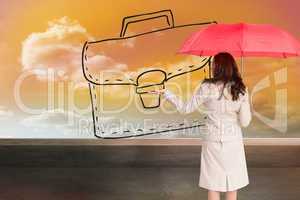 Composite image of businesswoman holding umbrella