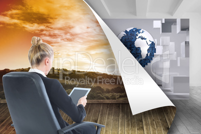 Composite image of businesswoman sitting on swivel chair with ta