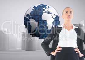 Composite image of businesswoman standing with hands on hips