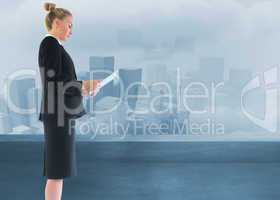 Composite image of businesswoman holding new tablet